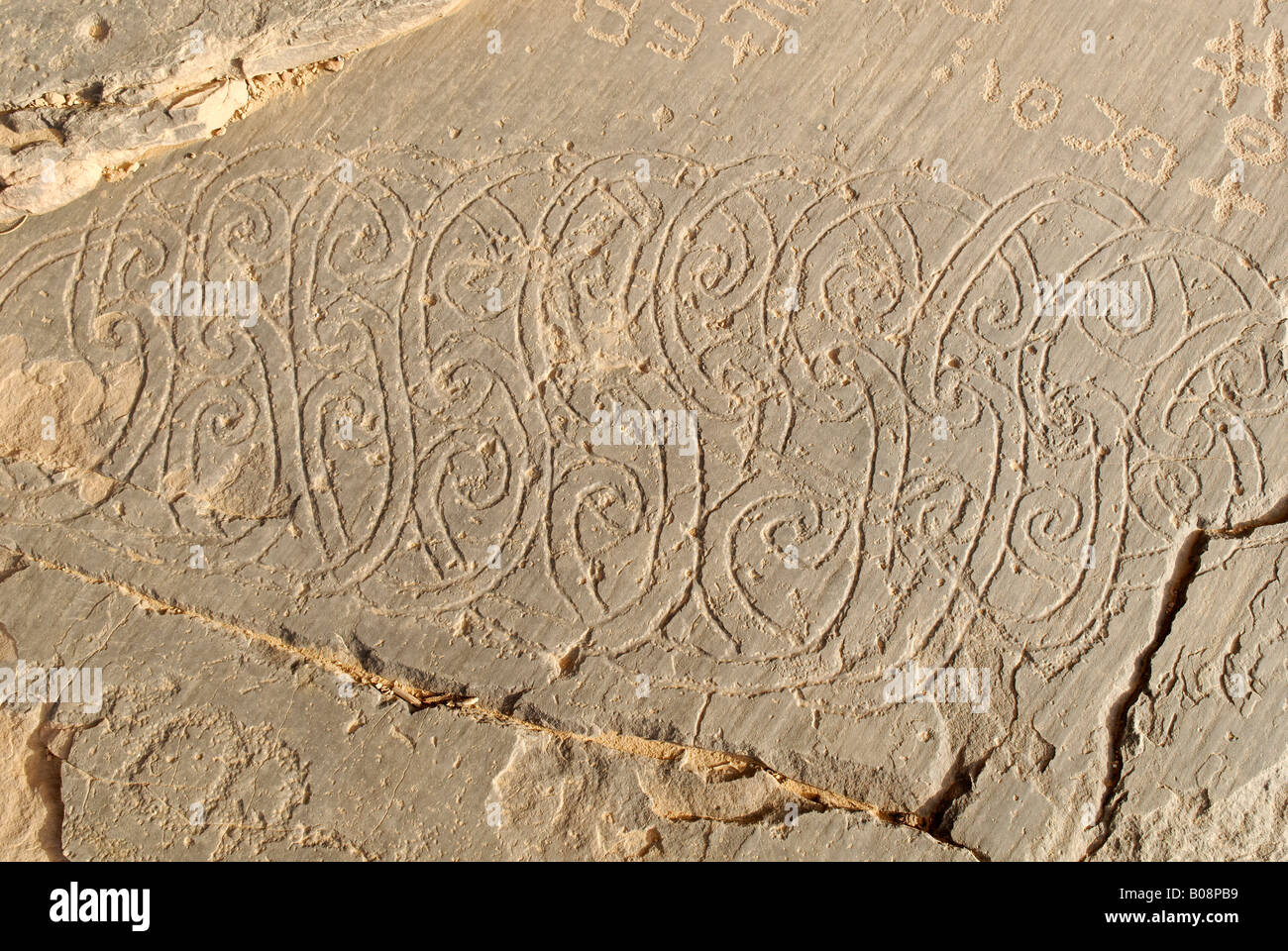 Early Islamic rock carvings, Youf Ahakit, Tassili du Hoggar, Wilaya Tamanrasset, Algeria, North Africa Stock Photo