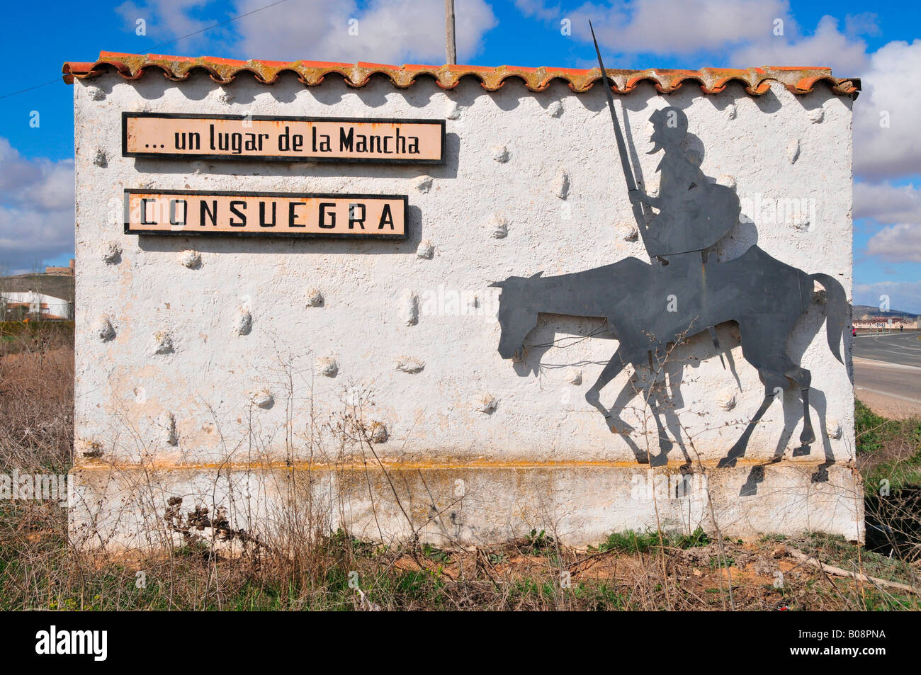 Sign with image of Don Quixote, Don Quijote at the town entrance of Consuegra, Castilla-La Mancha region, Spain Stock Photo