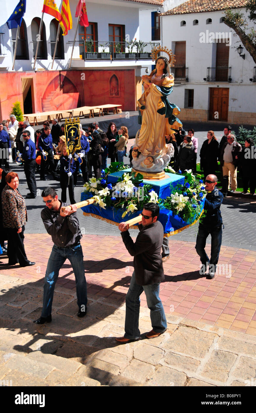 Men carrying a statue of the Virgin Mary, Semana Santa, Holy Week procession in La Nucia, Costa Blanca, Spain Stock Photo