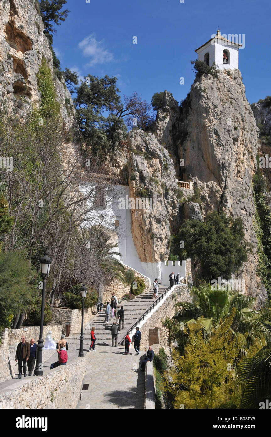 Tourists climbing steps between cliffs, Castell de Guadalest Castle, Guadalest, Costa Blanca, Spain Stock Photo