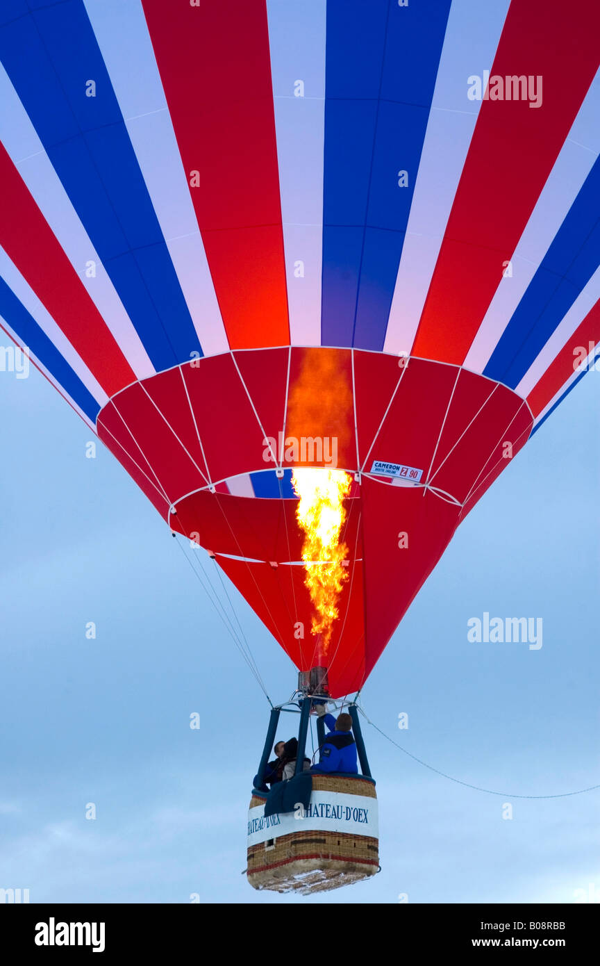 Hot air balloon ascending, International Balloon Festival in Château-d'Oex, Vaud, Switzerland Stock Photo
