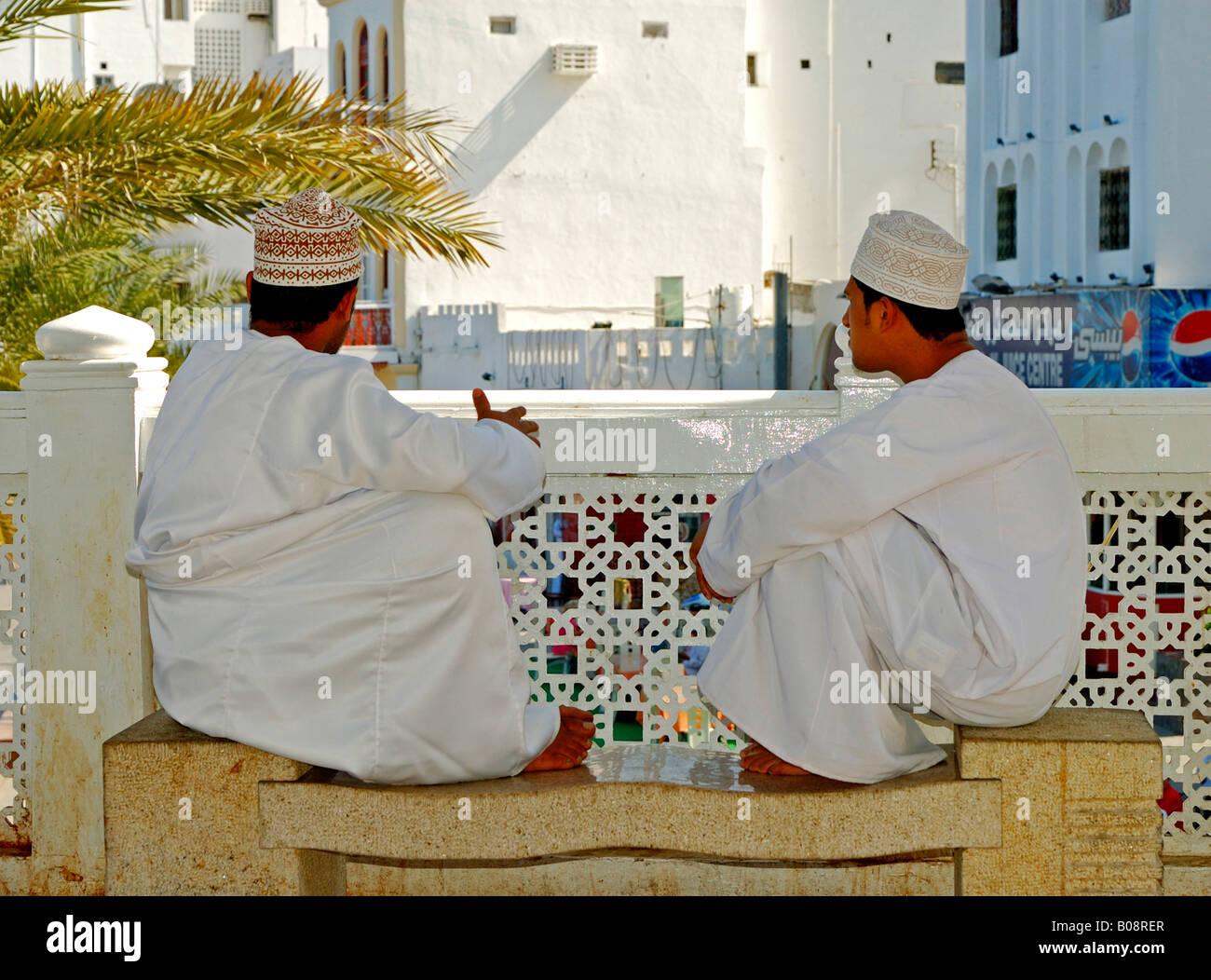 Two Omani men wearing traditional dishdashi or thawb clothing, robes, Muscat, Oman, Middle East Stock Photo