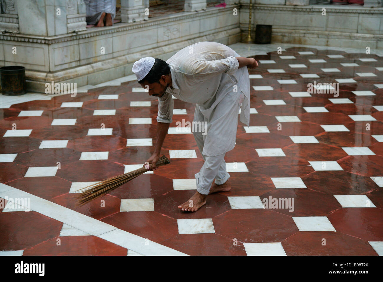 Man cleaning a Sufi shrine, Bareilly, Uttar Pradesh, India, Asia Stock Photo