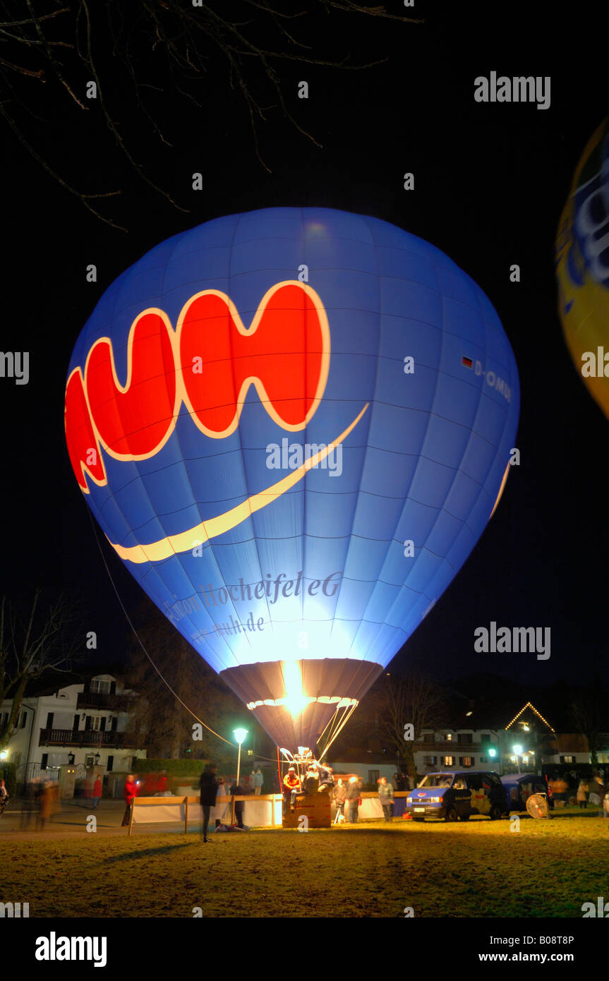 Hot air balloon glowing at night, festival in Bad Wiessee, Upper Bavaria, Bavaria, Germany Stock Photo