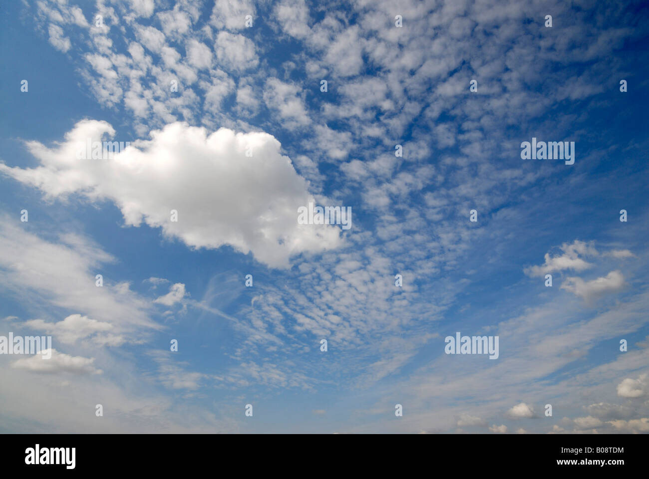 Cirrus and cumulus clouds Stock Photo