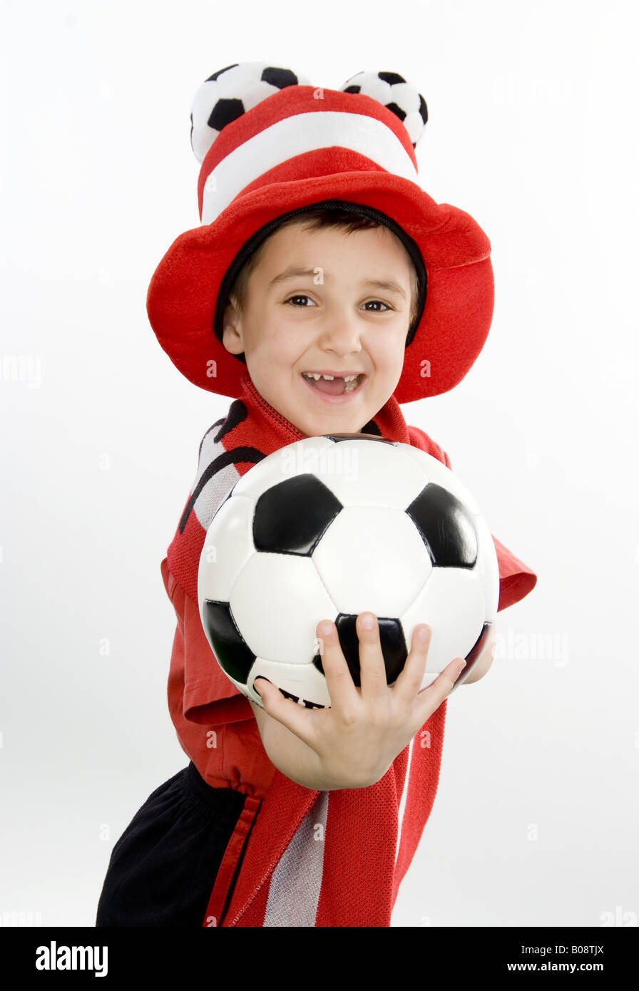 boy as Austrian soccer fan, with football and funny hat Stock Photo