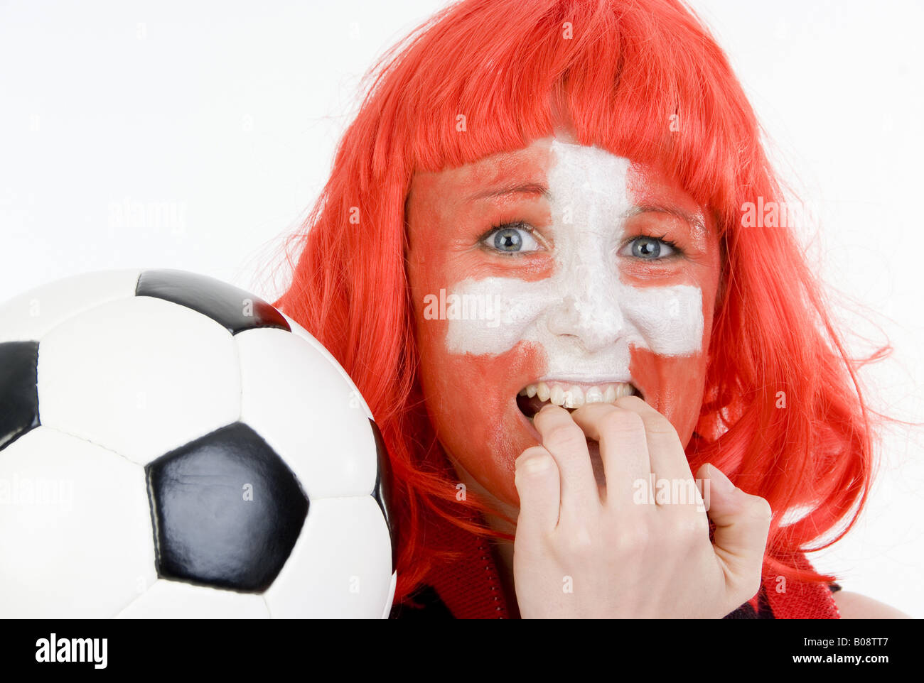 woman as Switzerland fan, with football, chewing on her finger nails Stock  Photo - Alamy