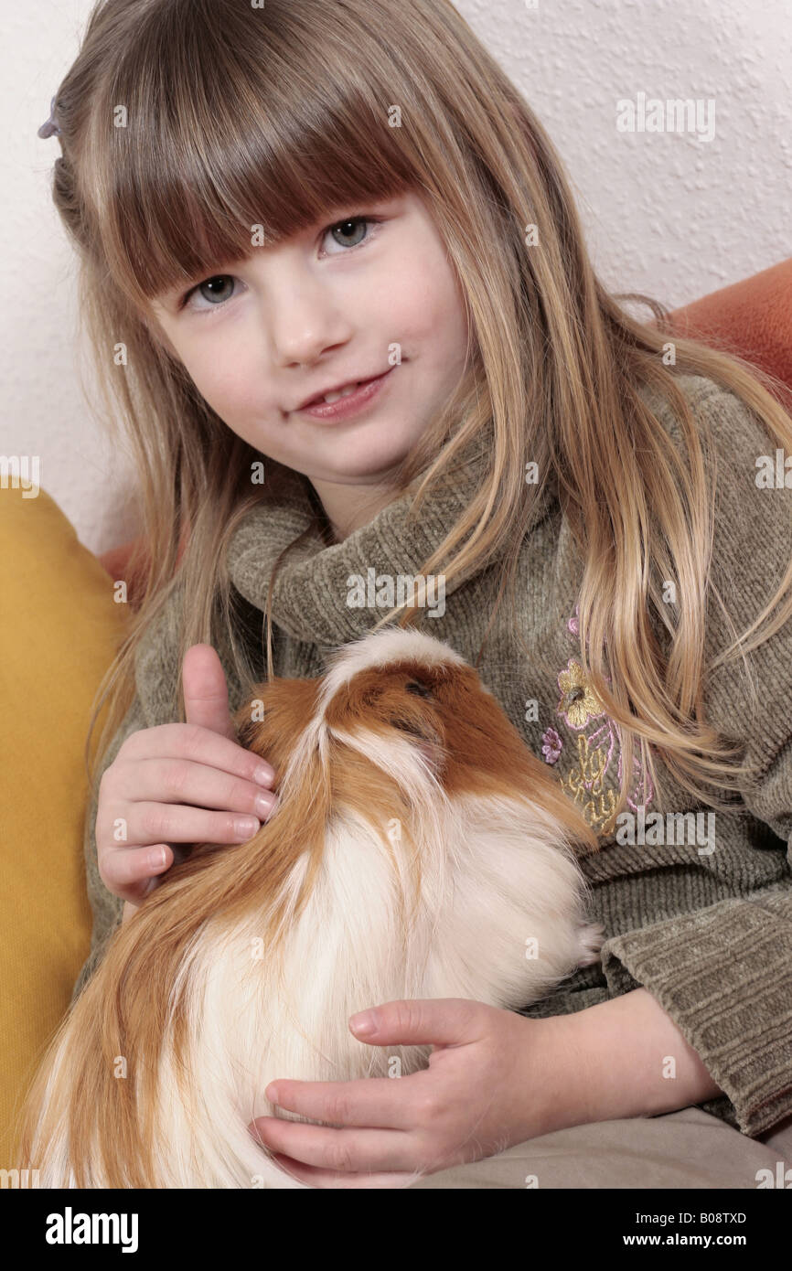 young girl with Guinea pig Stock Photo