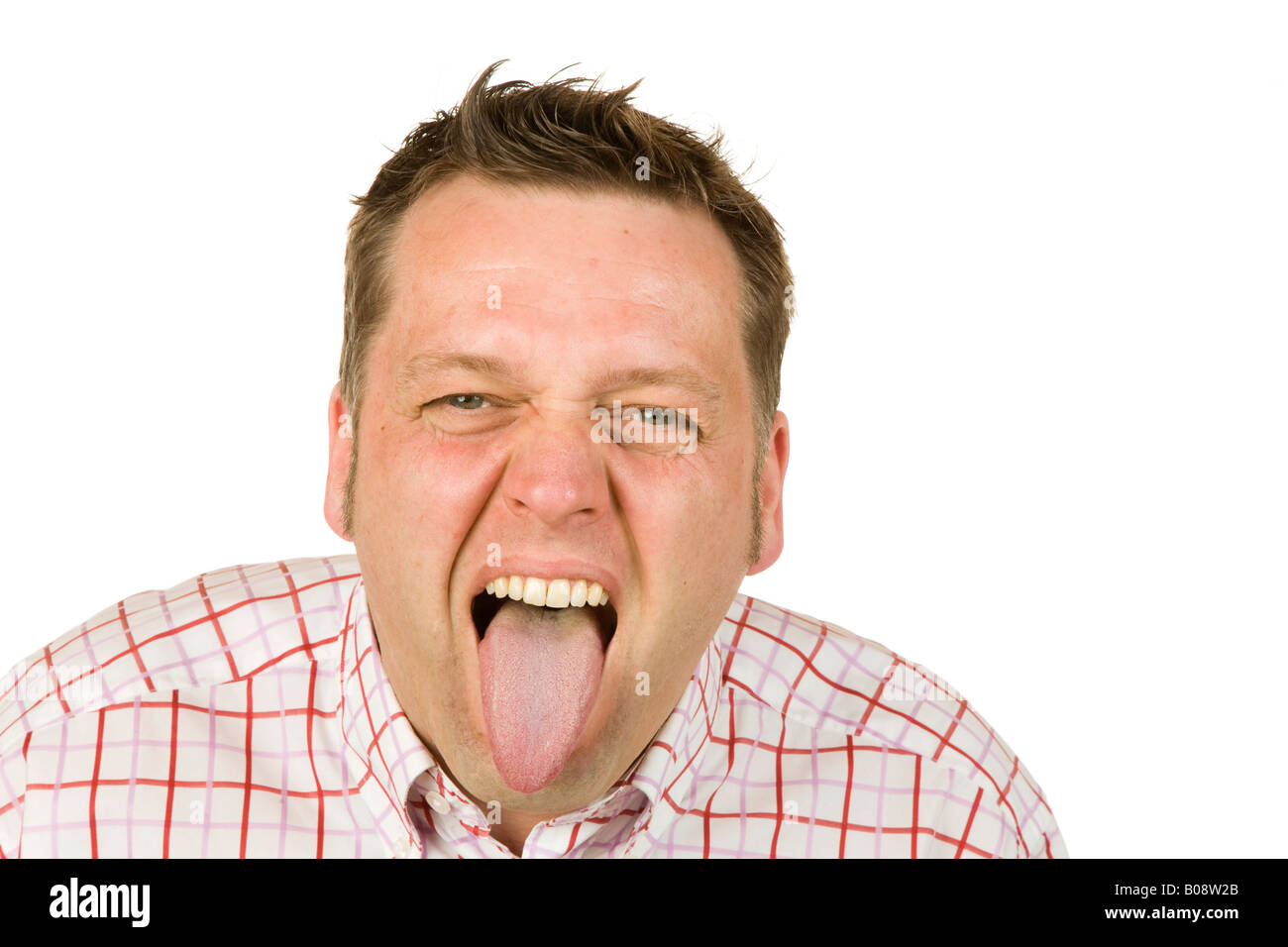 40-year-old man sticking out his tongue Stock Photo - Alamy