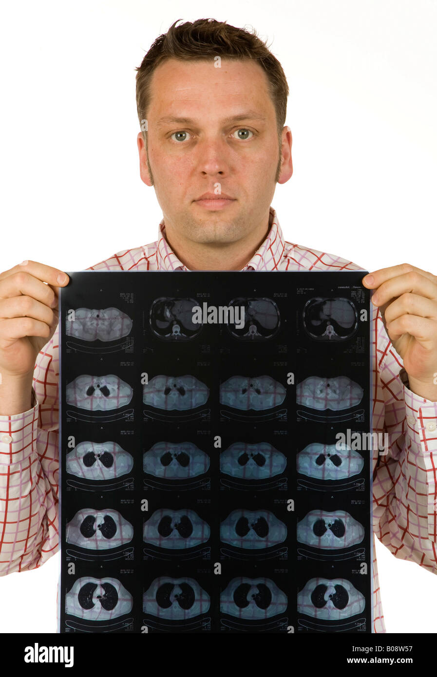 40-year-old businessman holding CT, CAT scan image Stock Photo
