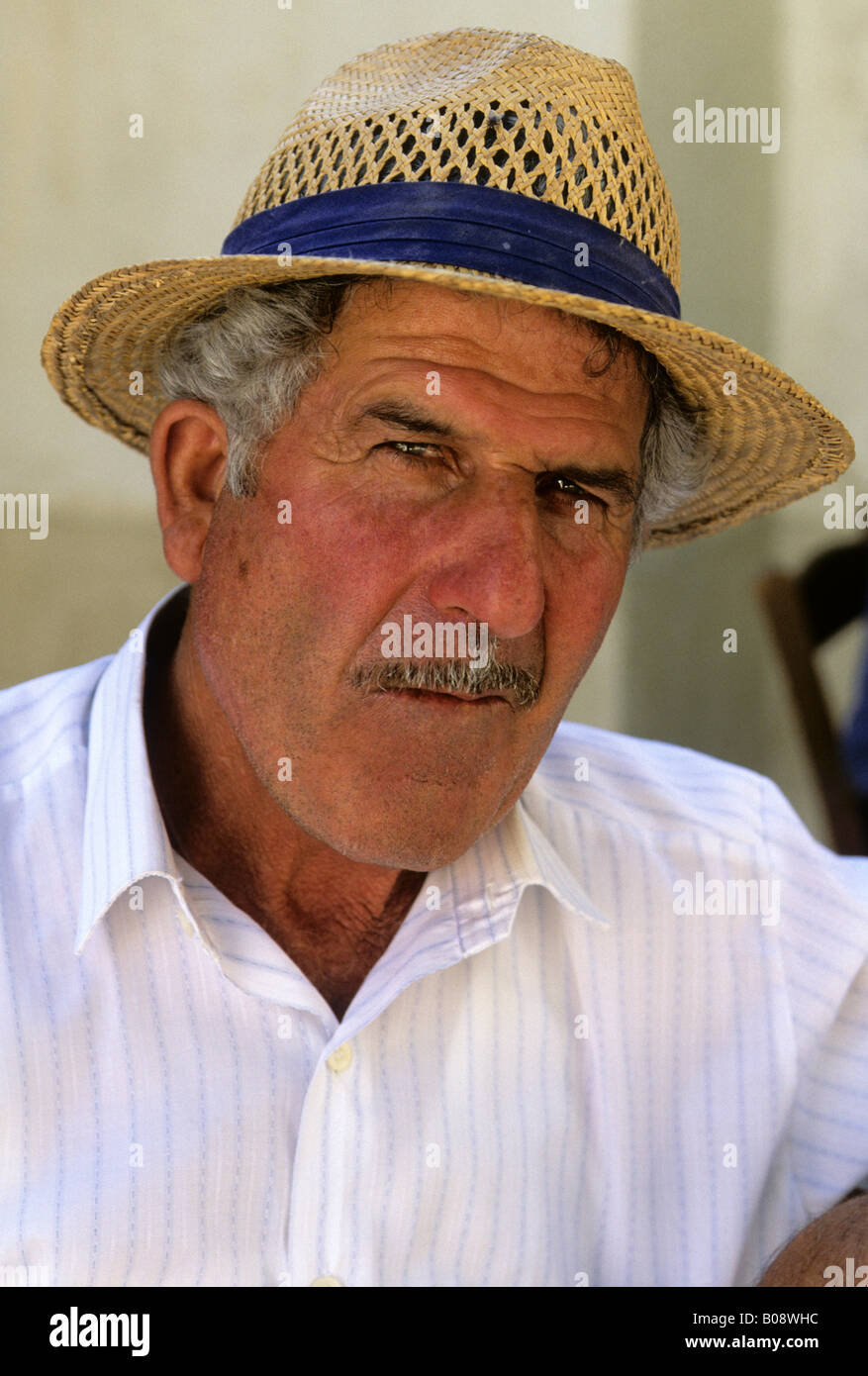 Man with moustache wearing a straw hat, Cyprus Stock Photo