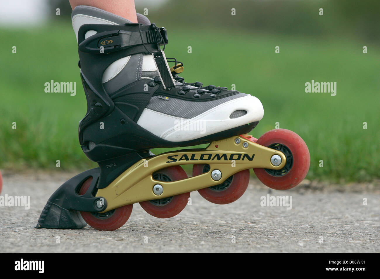 Inline skate with Softboot in brake position Stock Photo - Alamy