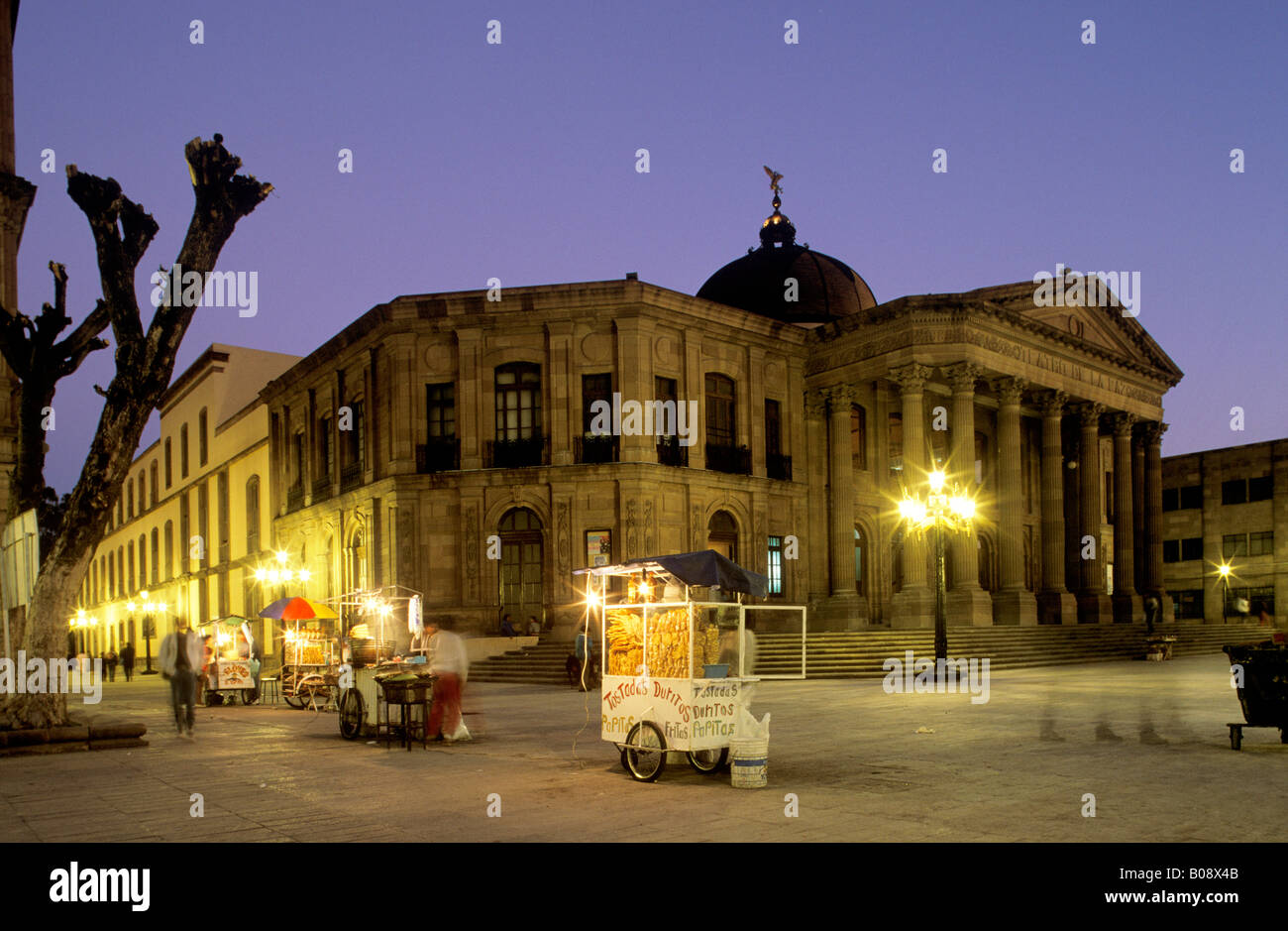 Teatro de la Paz theatre illuminated by street lamps at twilight, San Luis Potosí, San Luis Potosi, Mexico Stock Photo