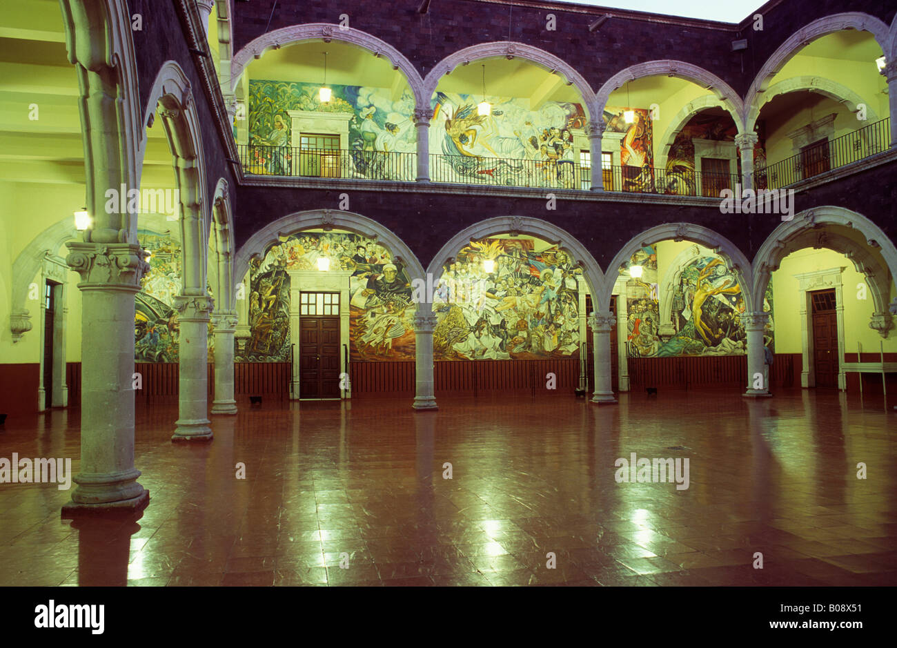 Mural paintings behind the arches of an atrium in the Palacio de Gobierno municipal government palace, Aguascalientes, Mexico Stock Photo
