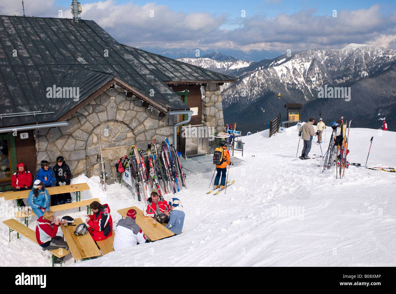 Skiers enjoying après ski outside a mountain restaurant at the Lukova Ski Resort, Jasna, Lower Tatras, Slovakia Stock Photo