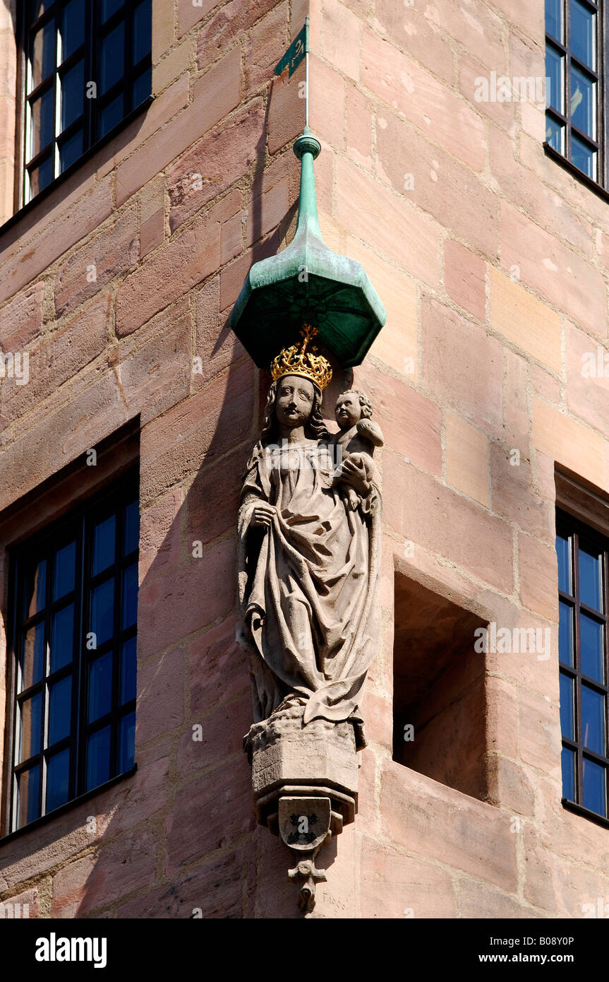 Statue of the Virgin Mary and baby Jesus on the corner of a building in Nuremberg, Bavaria, Germany Stock Photo