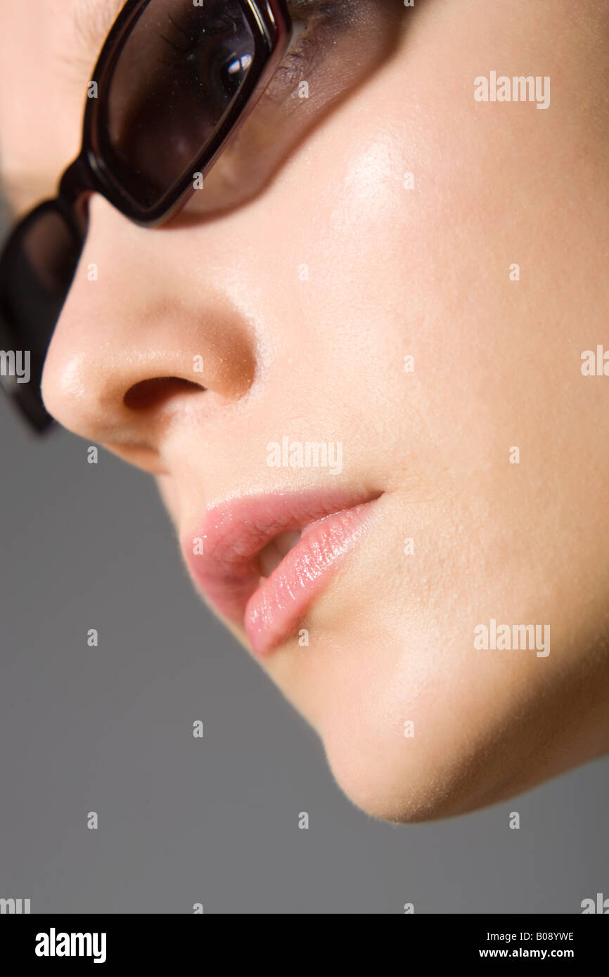 Closeup of a young woman wearing sunglasses Stock Photo