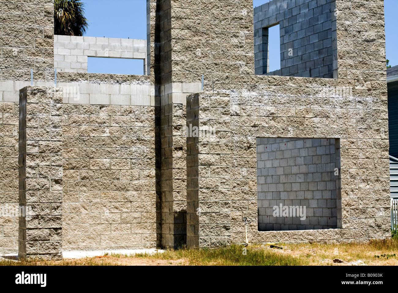 Concrete stone walls and pilings for a church building under construction with bricks Stock Photo