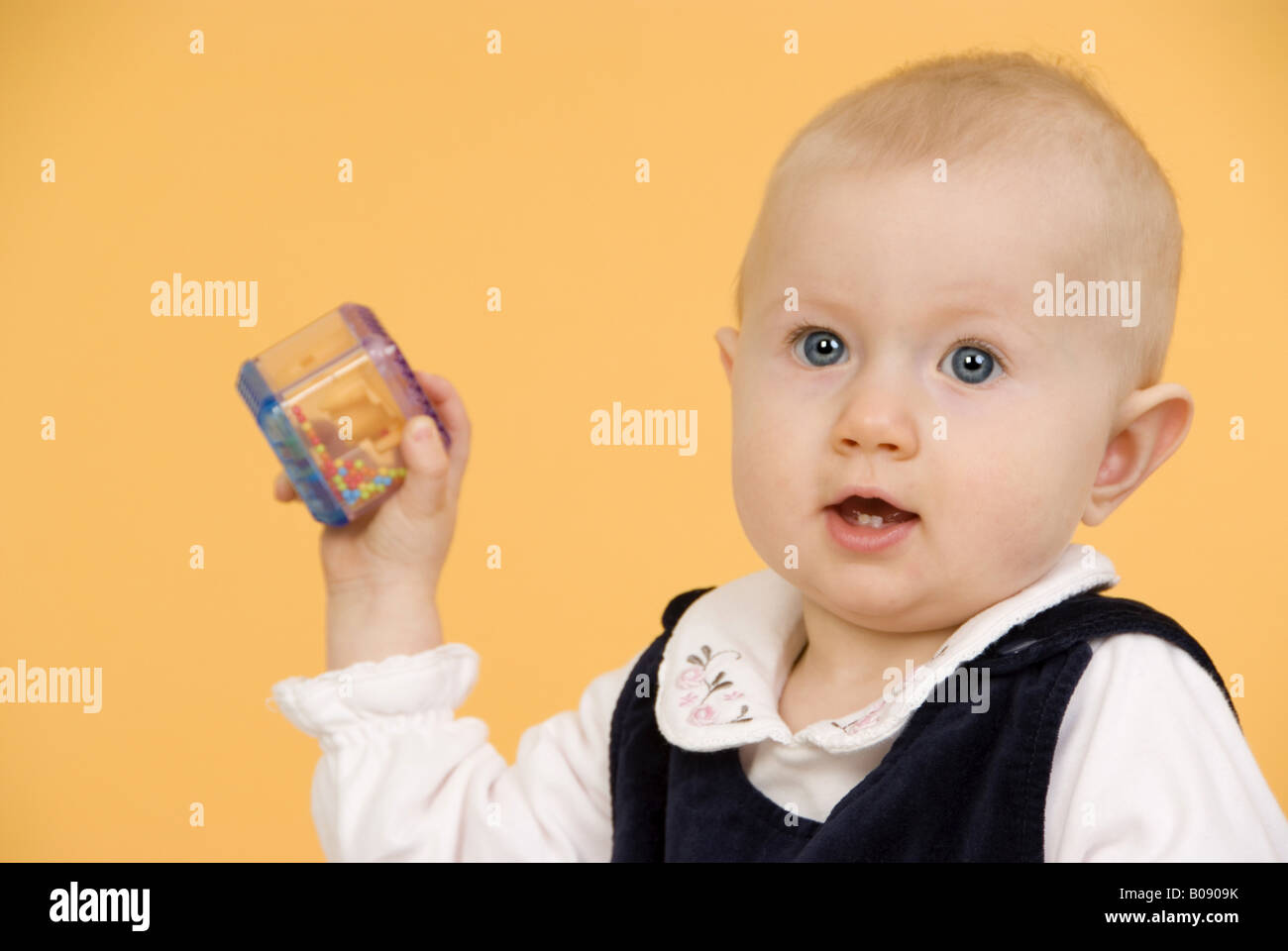 baby with rattle Stock Photo Alamy