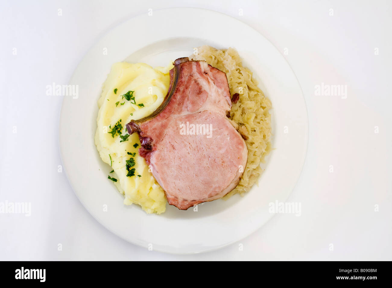 Smoked pork loin with sauerkraut and mashed potatoes Stock Photo