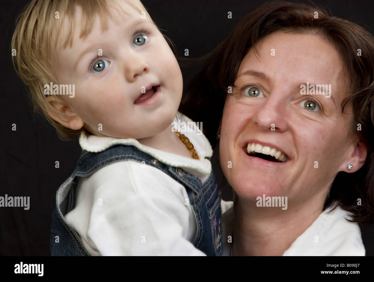 mother with her little daughter on her arms Stock Photo