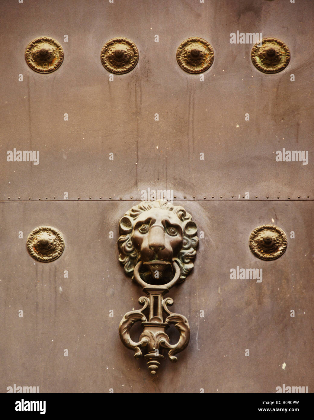Lion head door knocker on an old door in Seville, Andalusia, Spain Stock Photo