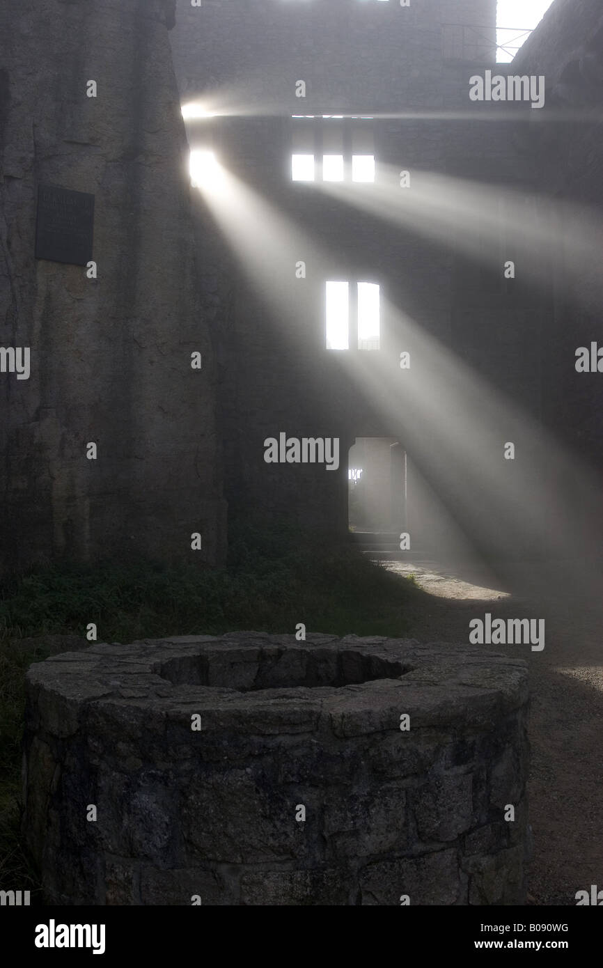 Castle in the mist, and fog lights radiate through windows, Germany, Baden-Baden Stock Photo