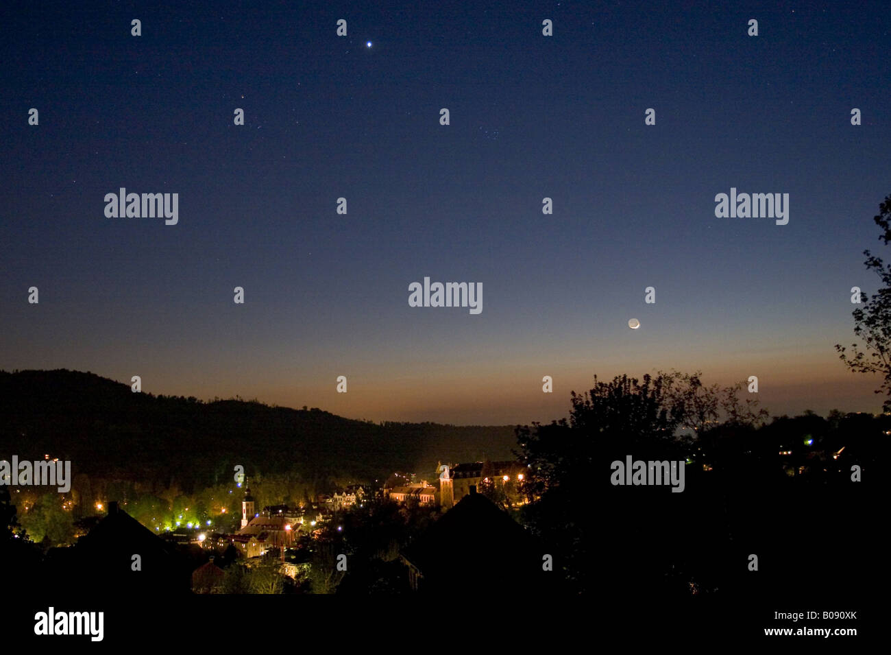 Moon and Venus in the evening sky over the town, Germany, Baden-Wuerttemberg, Baden-Baden Stock Photo