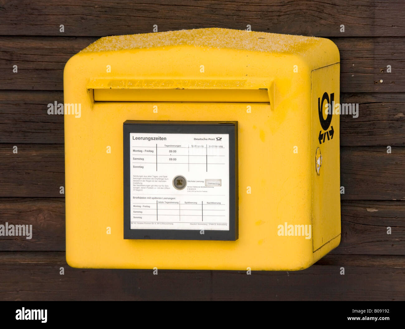 Deutsche Post, German Post letterbox, mailbox mounted on a wooden wall, Germany Stock Photo