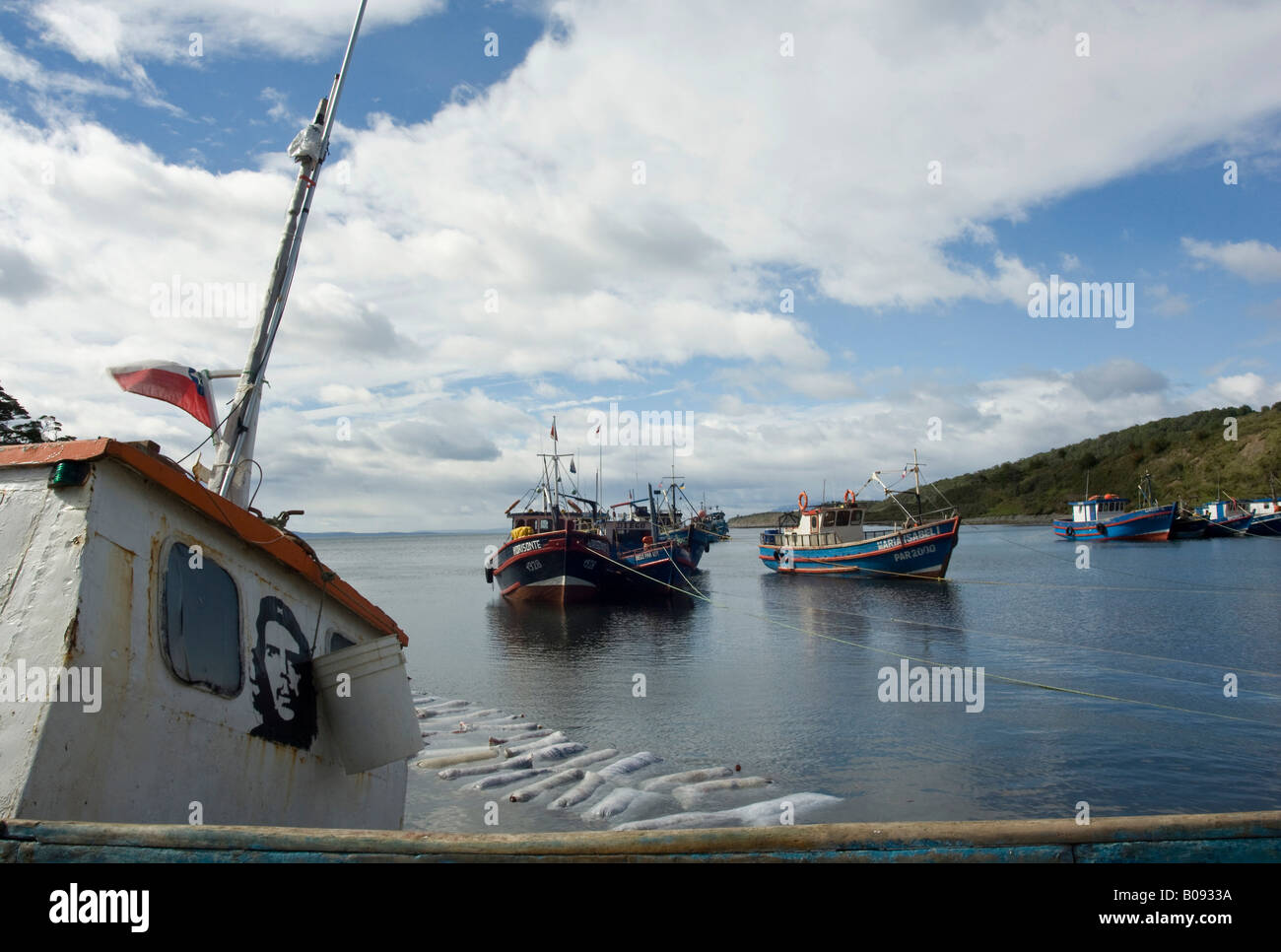 Fishing boats with likeness of Che Guevara painted on one, in the harbour of Puerto Hombre, Patagonia, Chile, South America Stock Photo