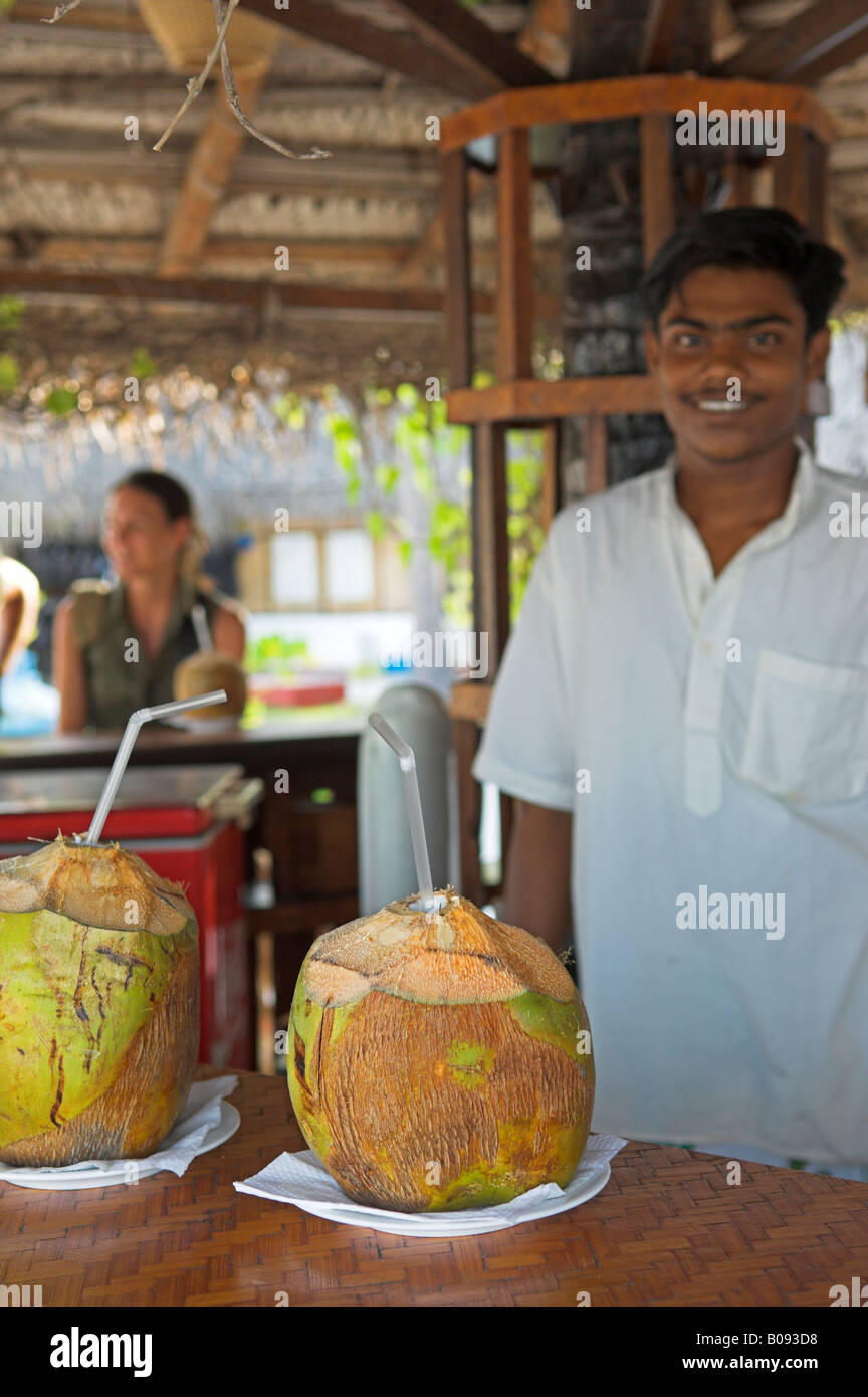 Fresh coconut cut open to serve as a drink on Bangaram Island