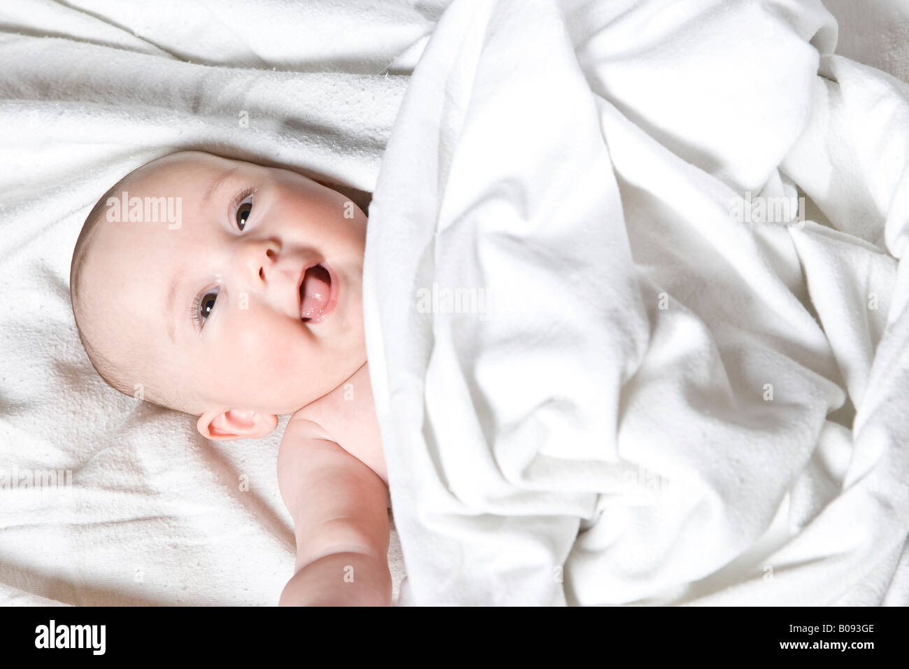 Four-month-old baby under a blanket Stock Photo