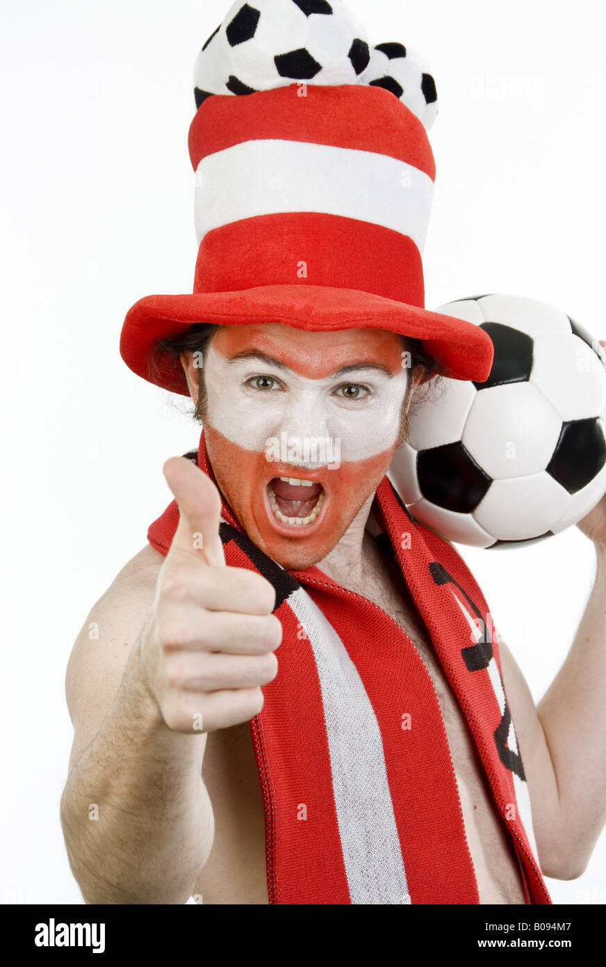 confident Austrian soccer fan makes thumb up Stock Photo