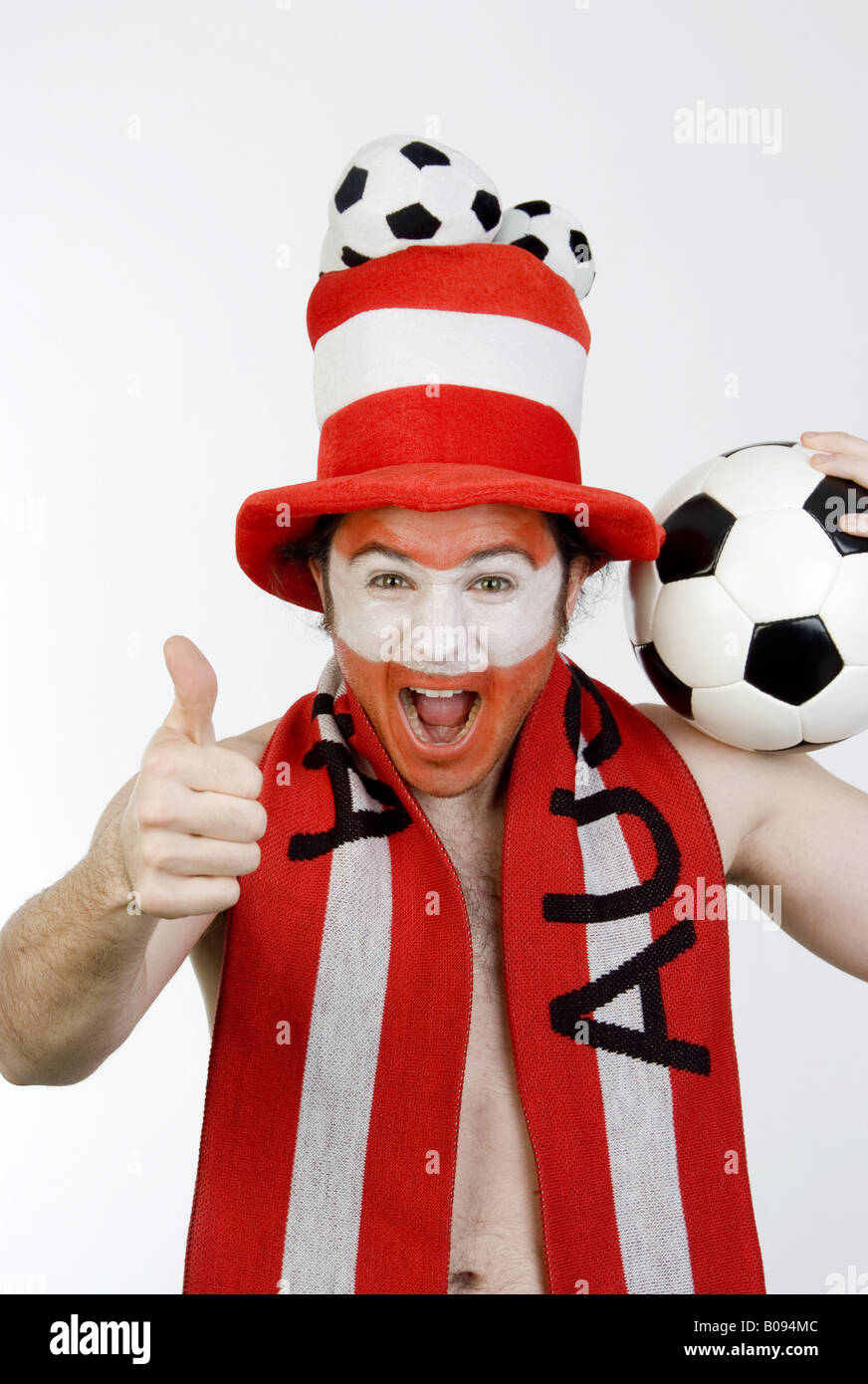 confident Austrian soccer fan makes thumb up Stock Photo