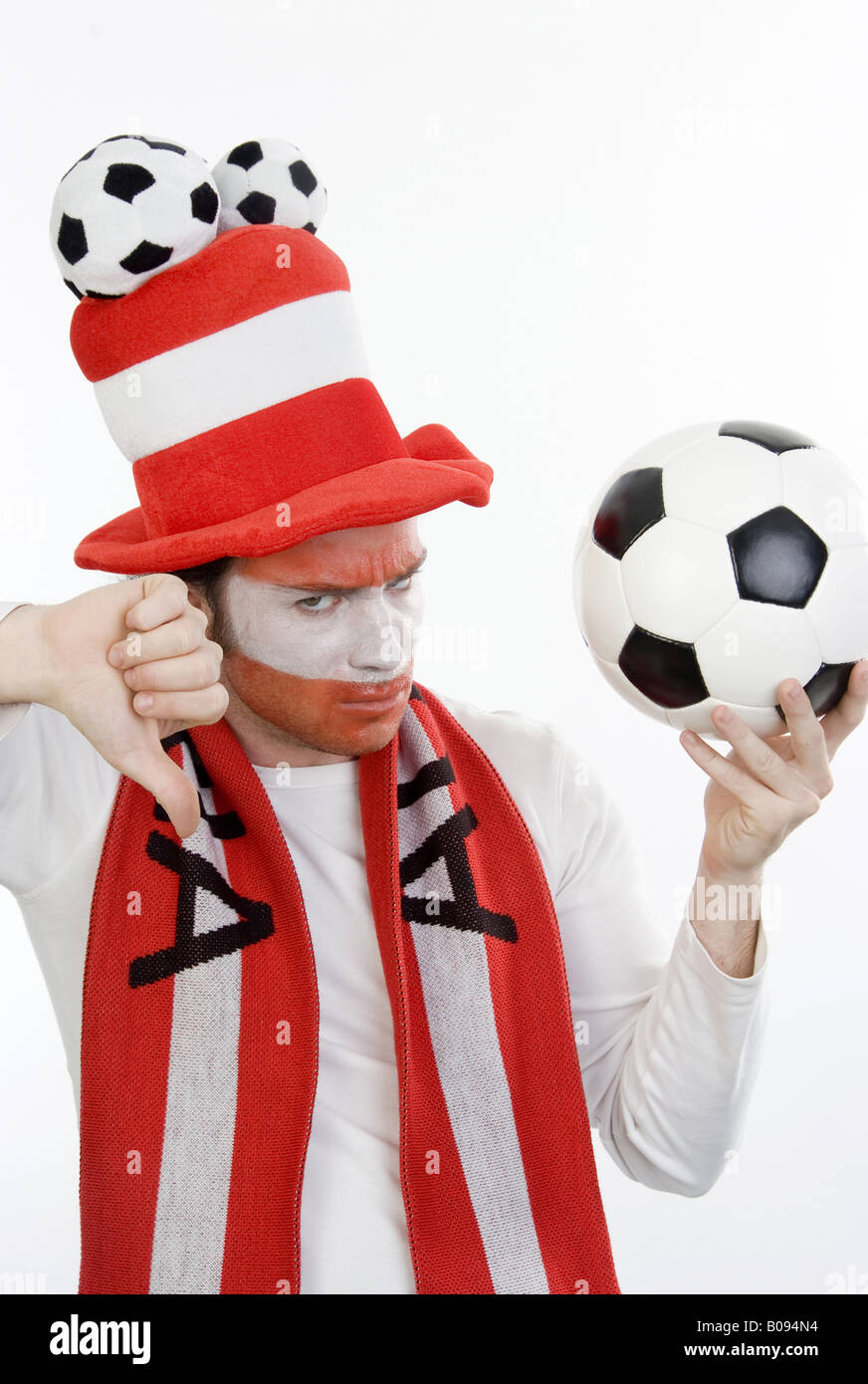 disappointed Austrian soccer fan makes thumb down Stock Photo