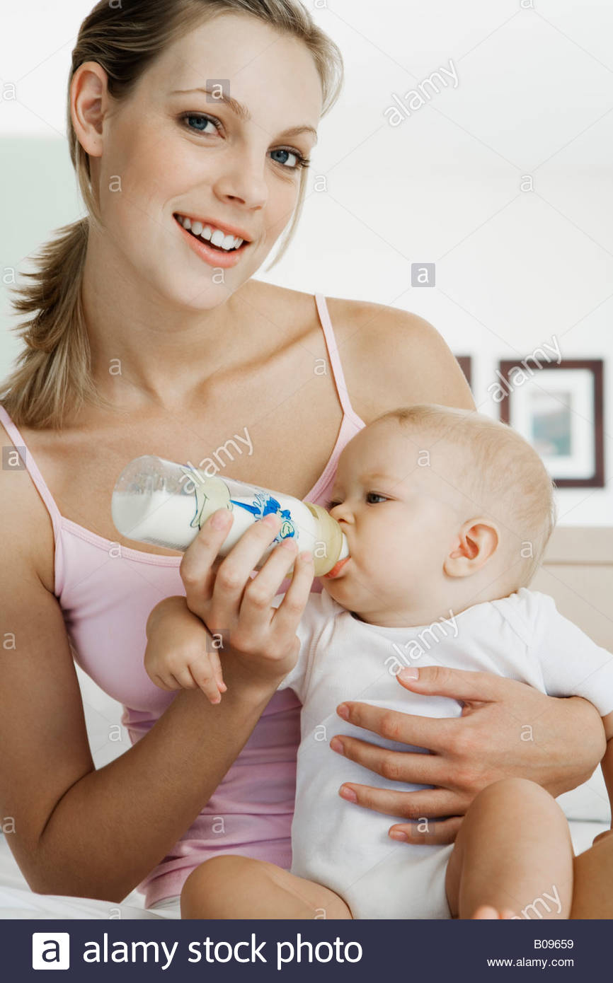 mother bottle feeding baby