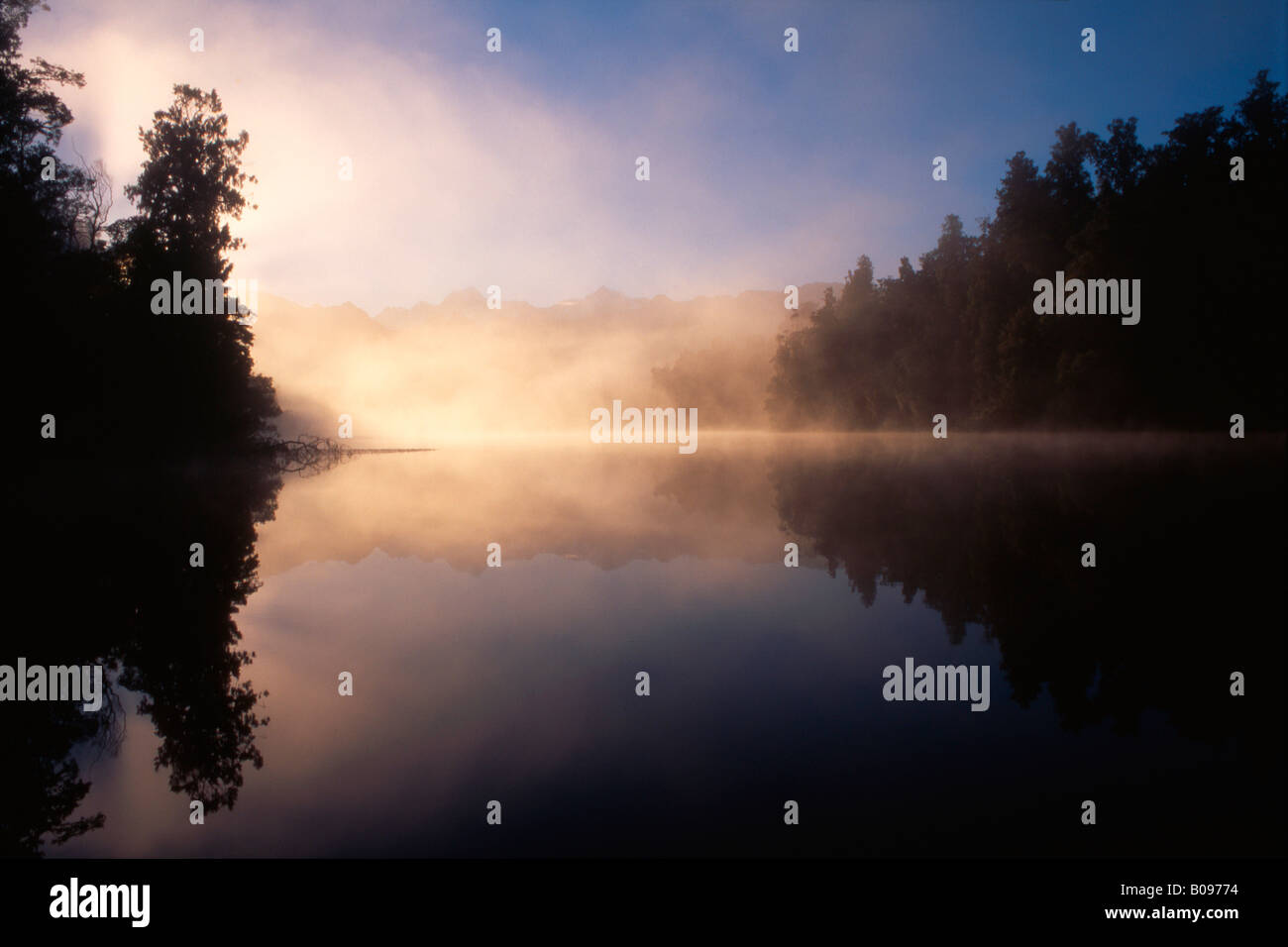 Mist rising from Lake Matheson, South Island, New Zealand Stock Photo