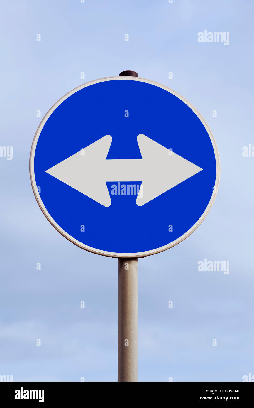 Traffic with a double arrow pointing left and right, looking for direction, directions Stock Photo