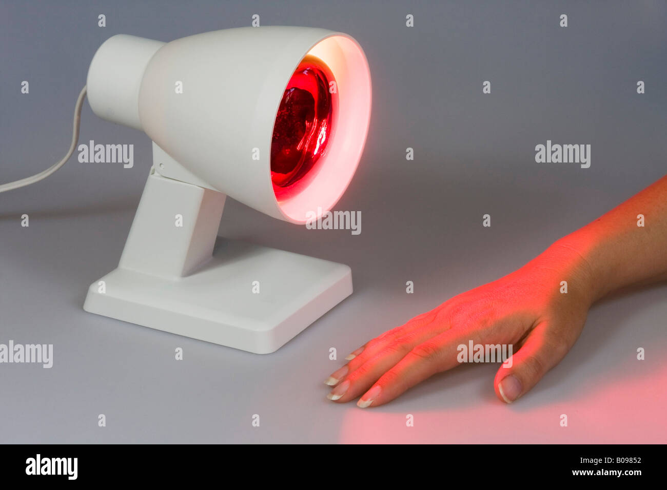 Infrared light beaming at a hand Stock Photo