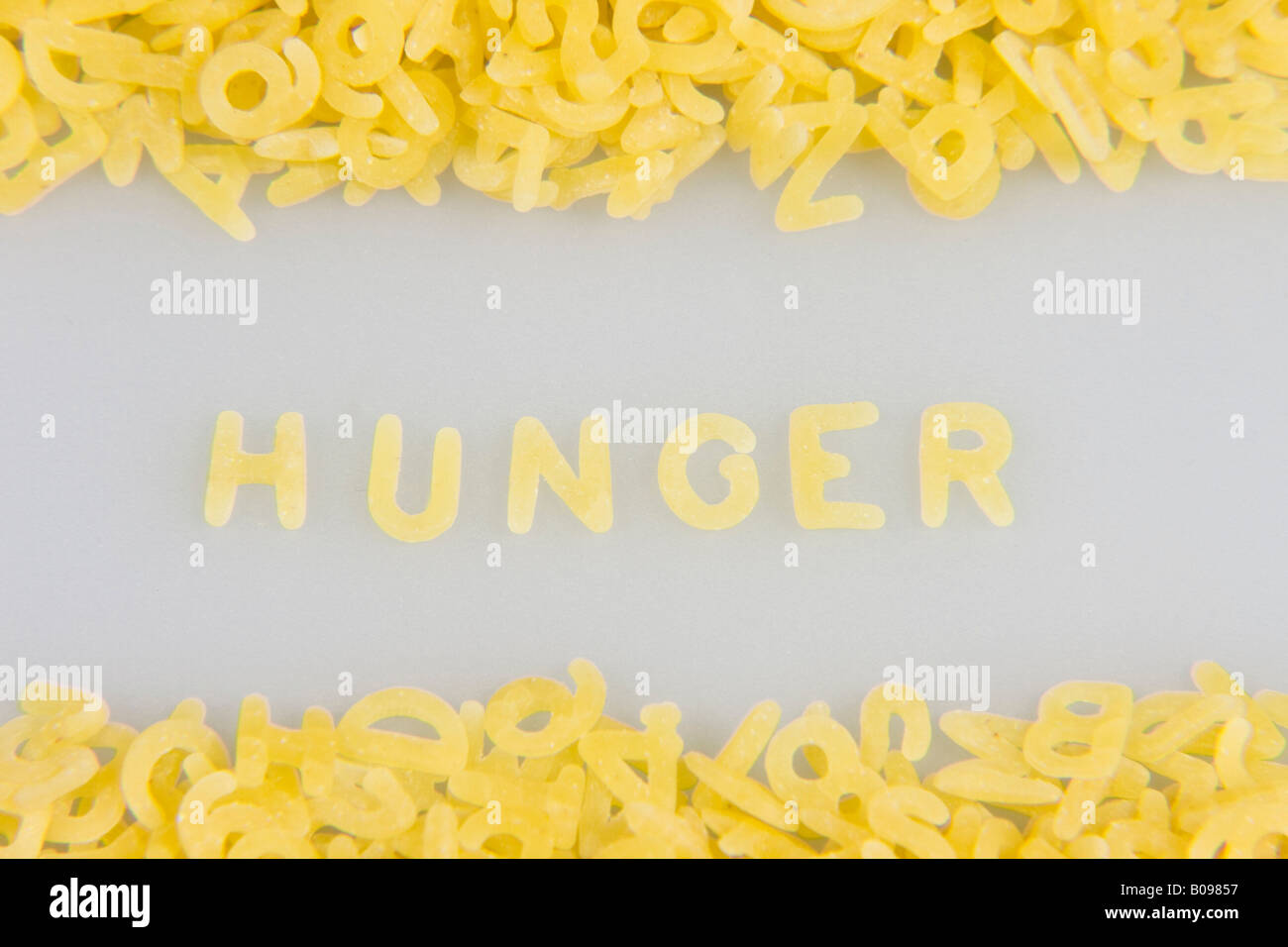 'Hunger' spelled out in noodle letters, pasta alphabet Stock Photo