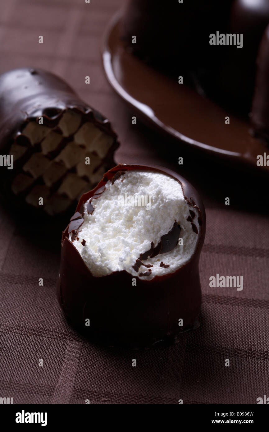 Chocolate-covered marshmallow treat, bitten into Stock Photo