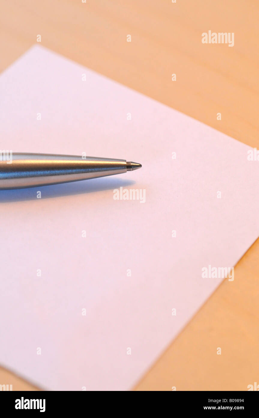 Pen laying on a blank piece of paper Stock Photo
