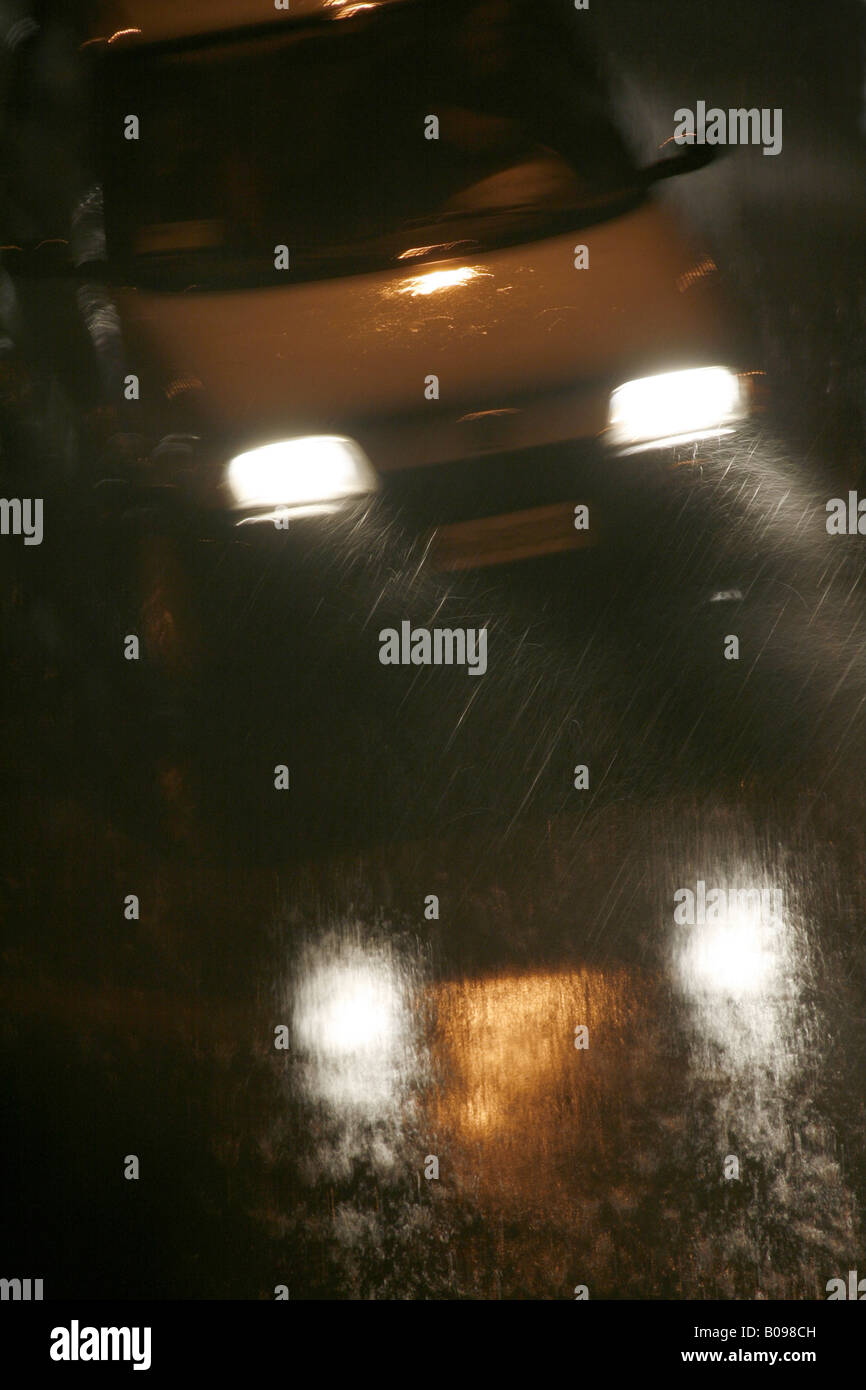 fast car driving in heavy rain at night in town Stock Photo - Alamy