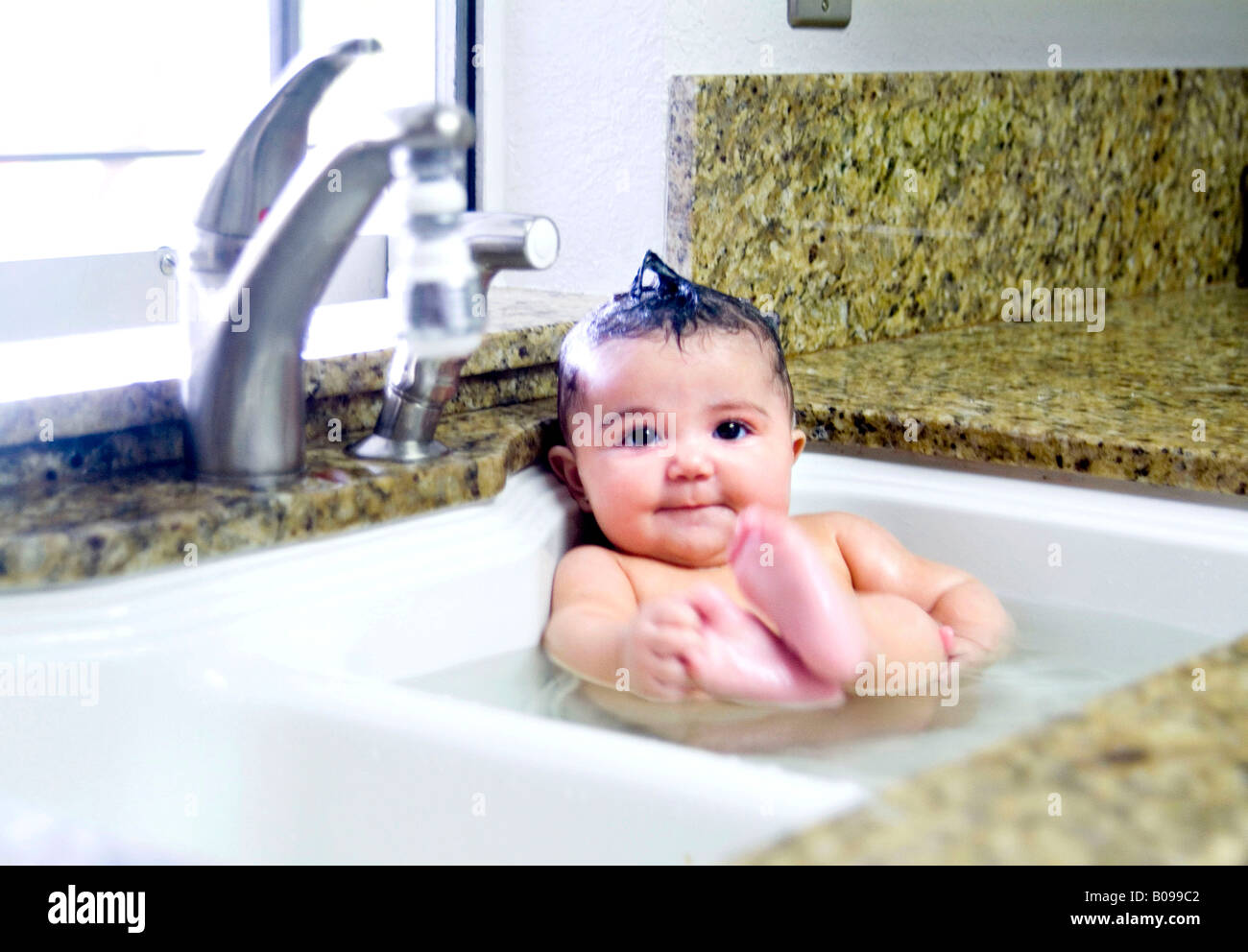Baby Taking A Bath In The Kitchen Sink Stock Photo 17415330