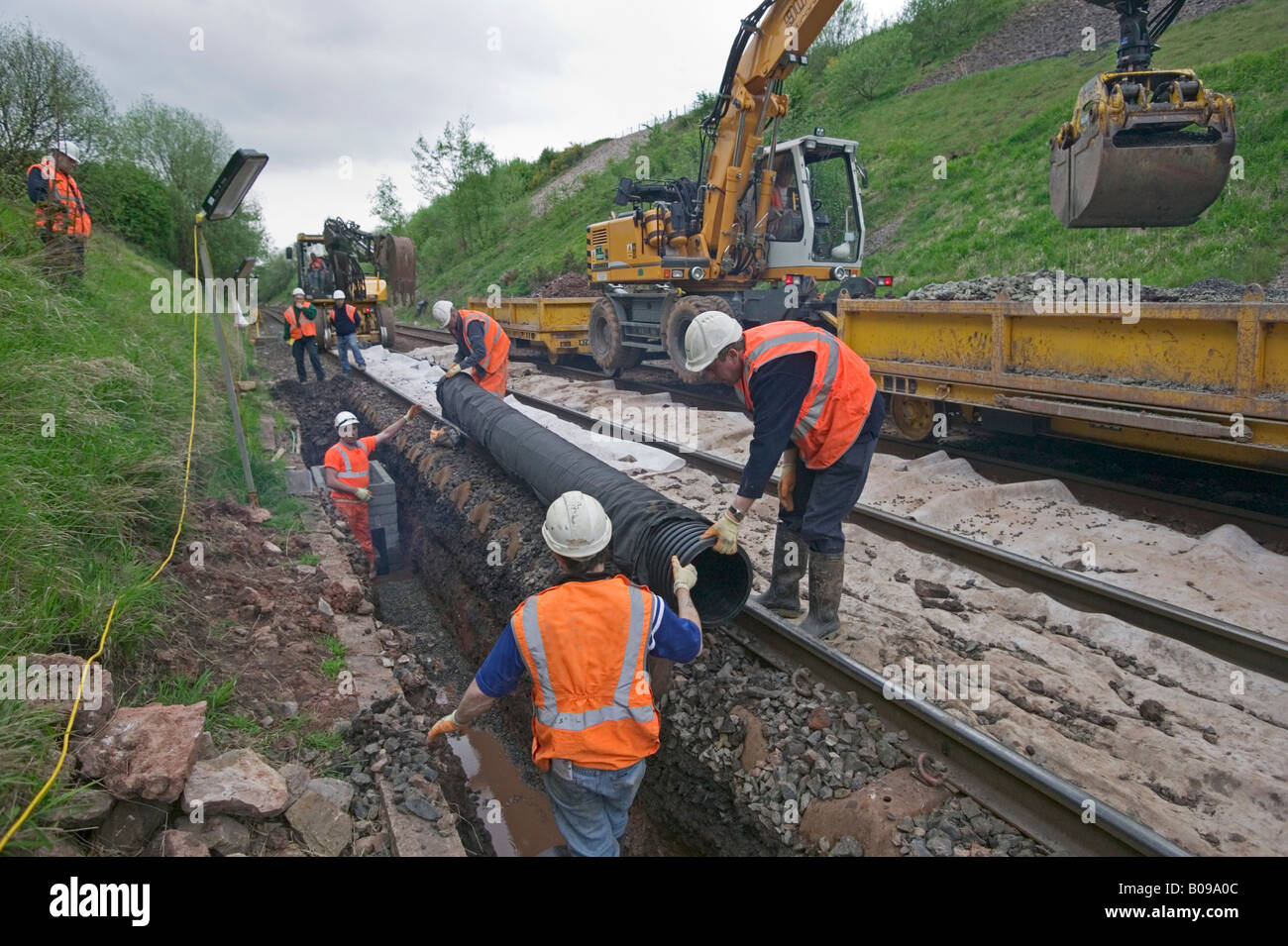 Specialist contractor using road-rail vehicles to maintain and replace outdated track components on a busy rail network. Stock Photo