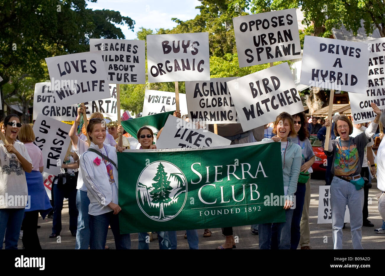Rally promoting the Sierra Club, with women holding banners promoting environmental issues such as hybrid cars and organic food. Stock Photo