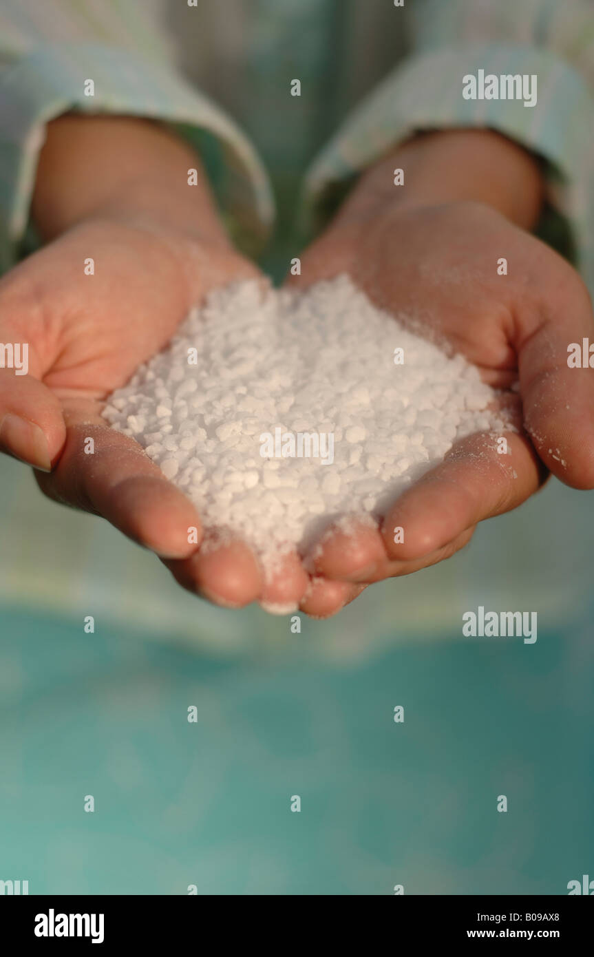 Someone holding a handful of sugar Stock Photo