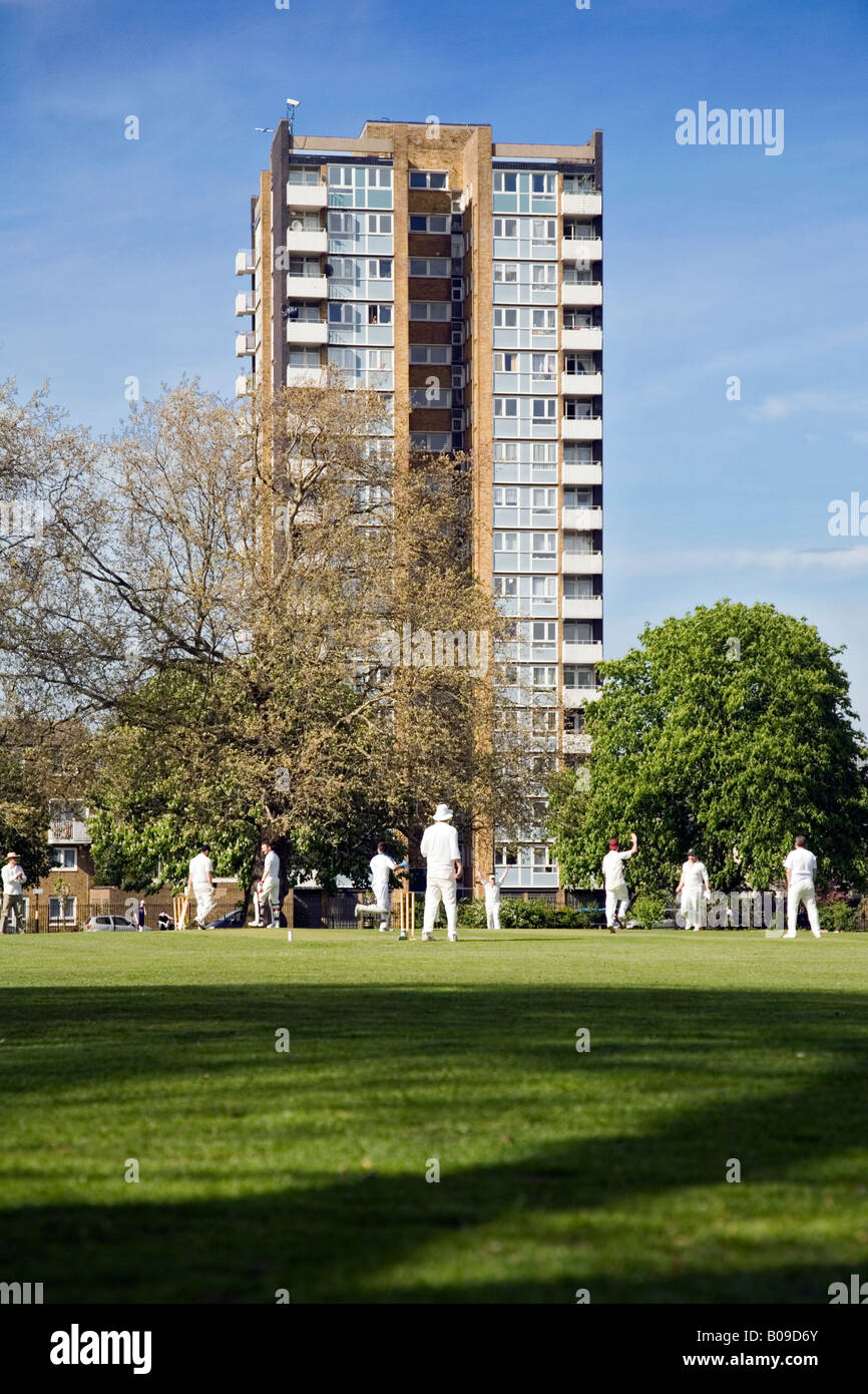 a game of cricket being played on London Fields, Hackney, London Stock Photo