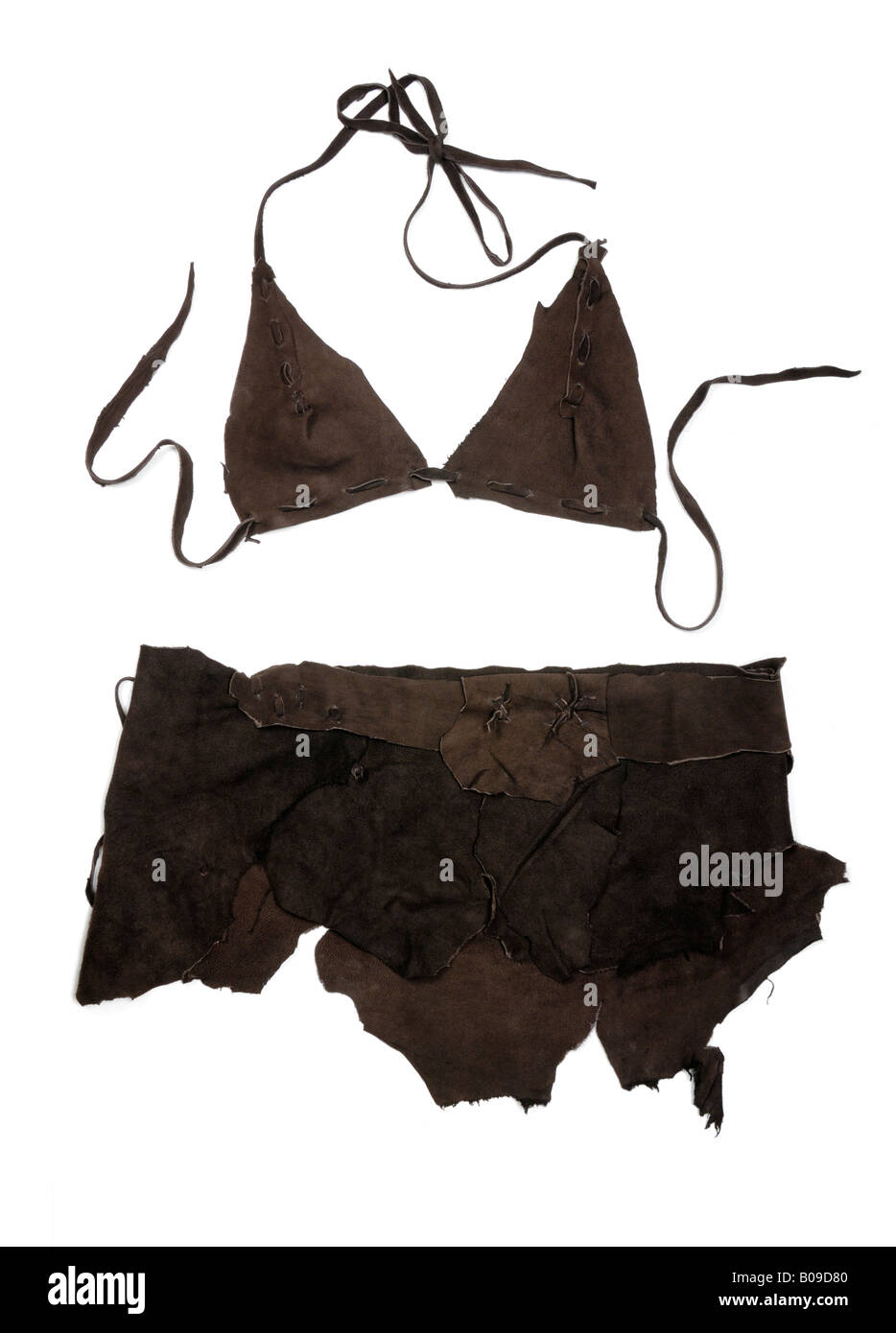 Cave woman leather outfit Stock Photo