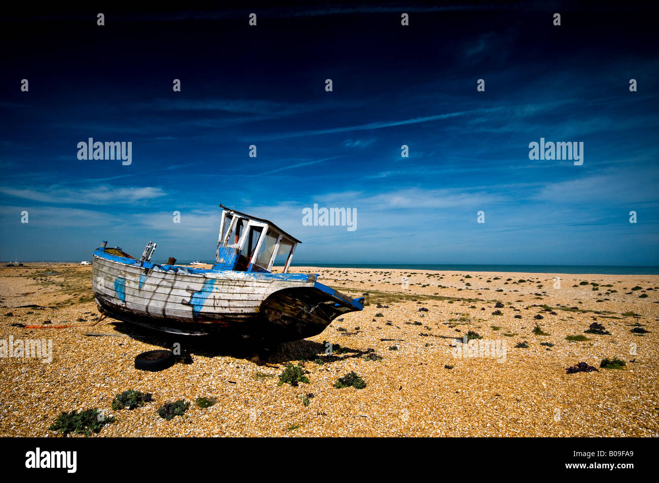 Dungeness - an abandoned old wooden fishing boat at Dungeness Kent ...
